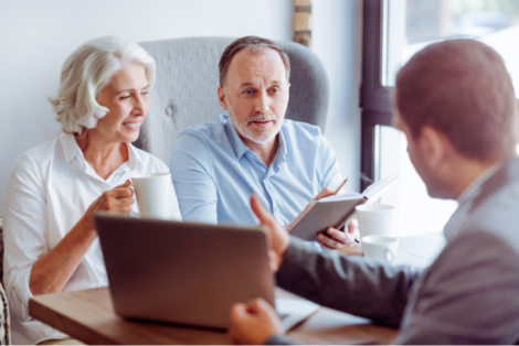 A couple being shown information from a salesman