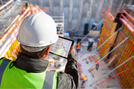 Construction worker overlooking work site