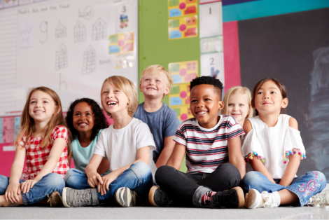 Kindergartners sitting together in a classroom