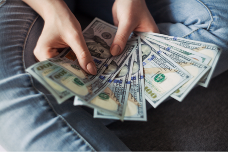 Person fanning out their cash