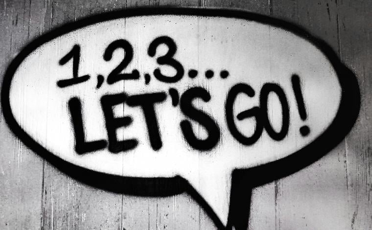 a wall that has spraypaint art on it that reads "1, 2, 3, let's go!"