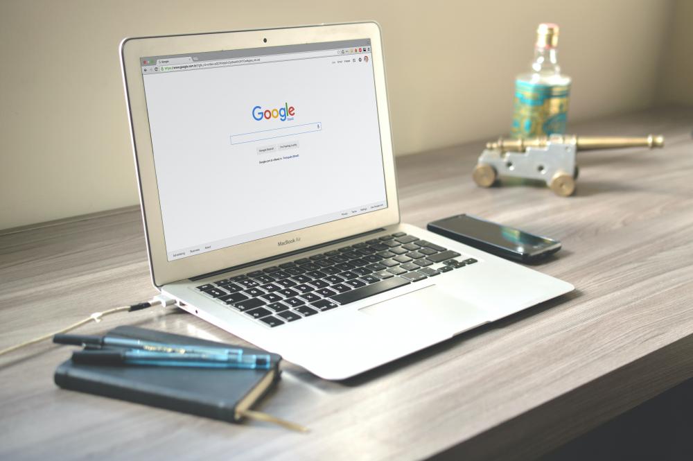 a laptop with google open on the screen