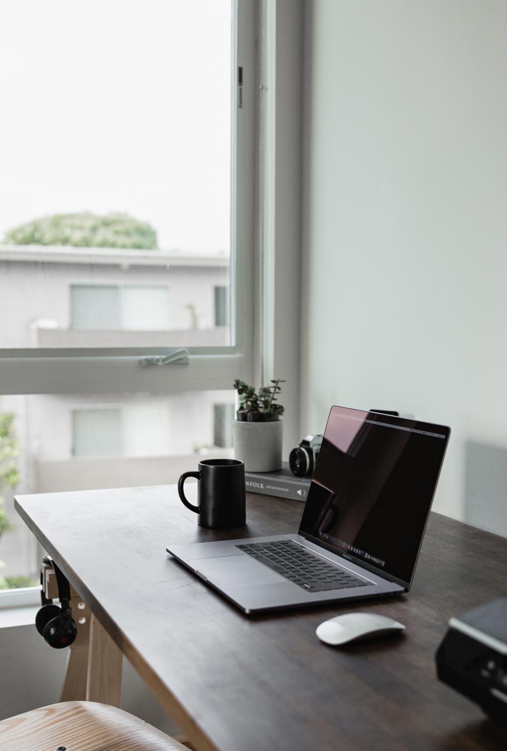 home office desk with laptop